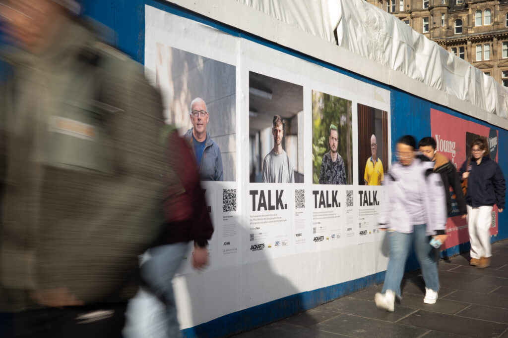 TALK. Portraits. by Graham Williams. Four portraits of men on billboards in Edinburgh's city centre