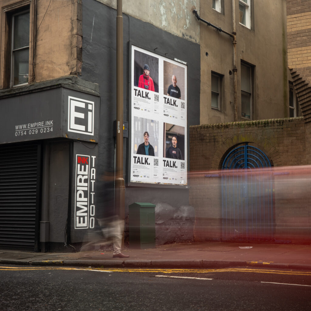 TALK. Portraits. by Graham Williams. Four portraits of men on billboards in Edinburgh's city centre